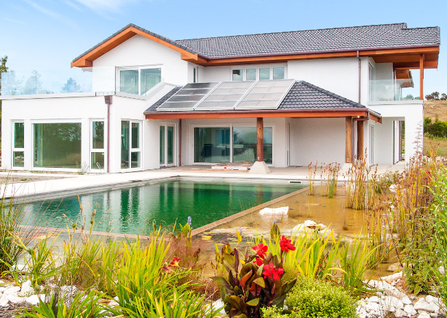 house with pool in backyard with sliding doors