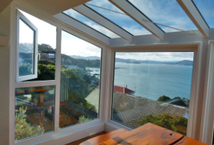 house corner with different windows in different shapes and sizes